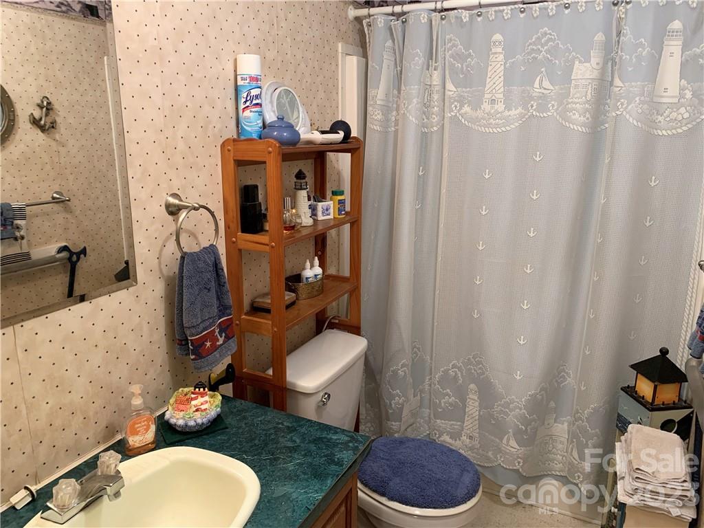 123 Beech Tree Lane Rutherfordton, NC 28139 - Photo 35 of 48 a bathroom with a sink toilet and shower