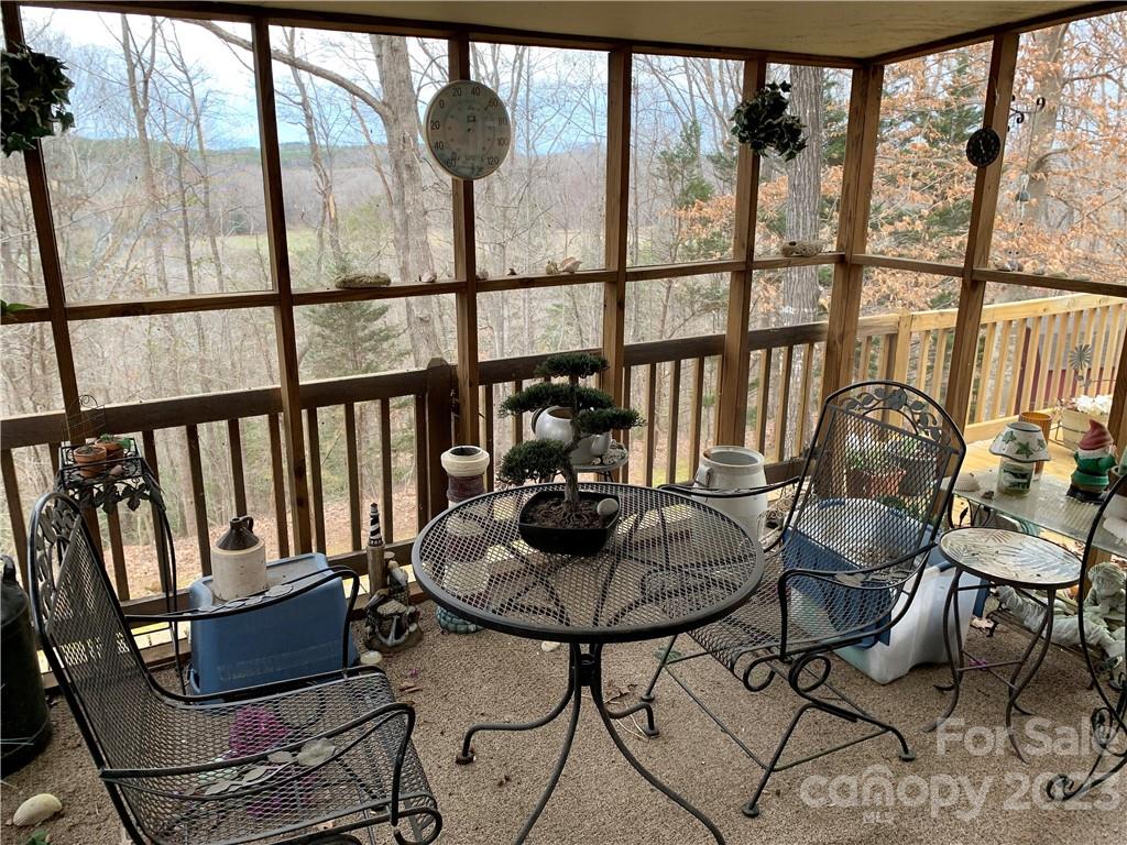 123 Beech Tree Lane Rutherfordton, NC 28139 - Photo 44 of 48 a living room with furniture and a floor to ceiling window