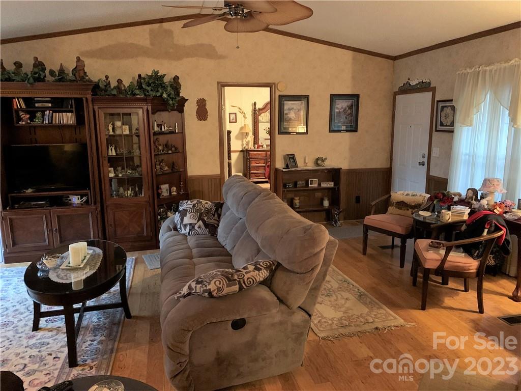 123 Beech Tree Lane Rutherfordton, NC 28139 - Photo 5 of 48 a living room with furniture and a flat screen tv