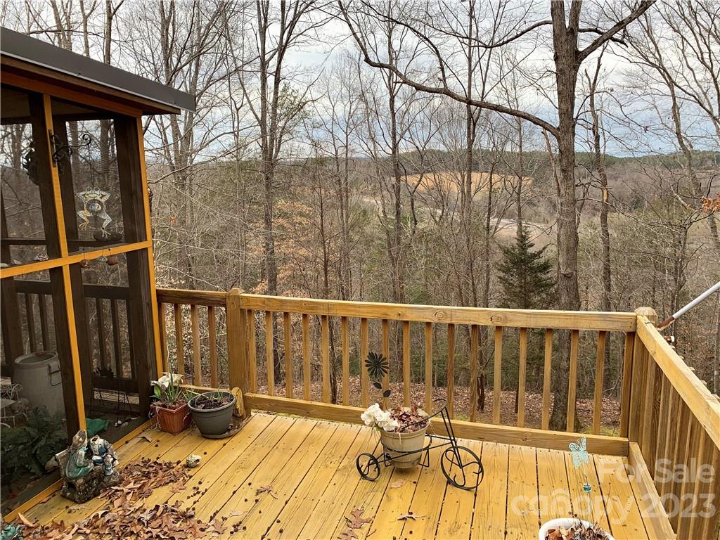 123 Beech Tree Lane Rutherfordton, NC 28139 - Photo 7 of 48 a view of balcony with wooden floor and outdoor seating