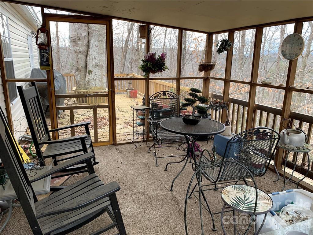 123 Beech Tree Lane Rutherfordton, NC 28139 - Photo 8 of 48 a view of a dining room with furniture wooden floor and a window