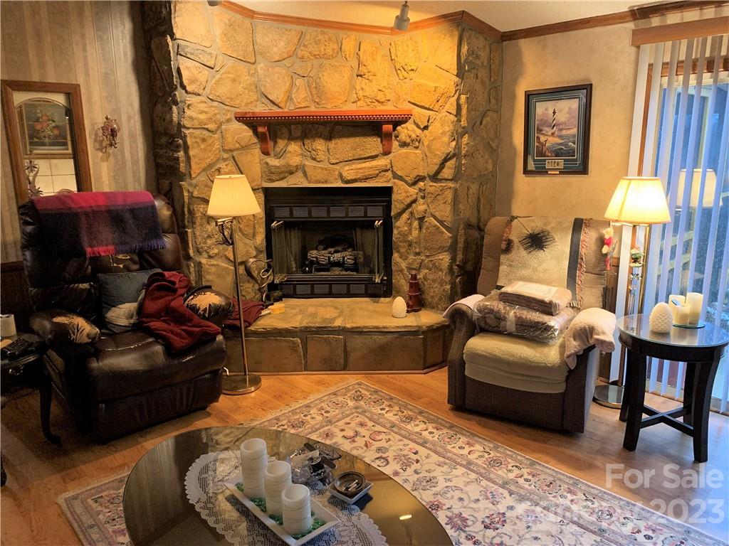 123 Beech Tree Lane Rutherfordton, NC 28139 - Photo 10 of 48 a living room with furniture fireplace and a fireplace