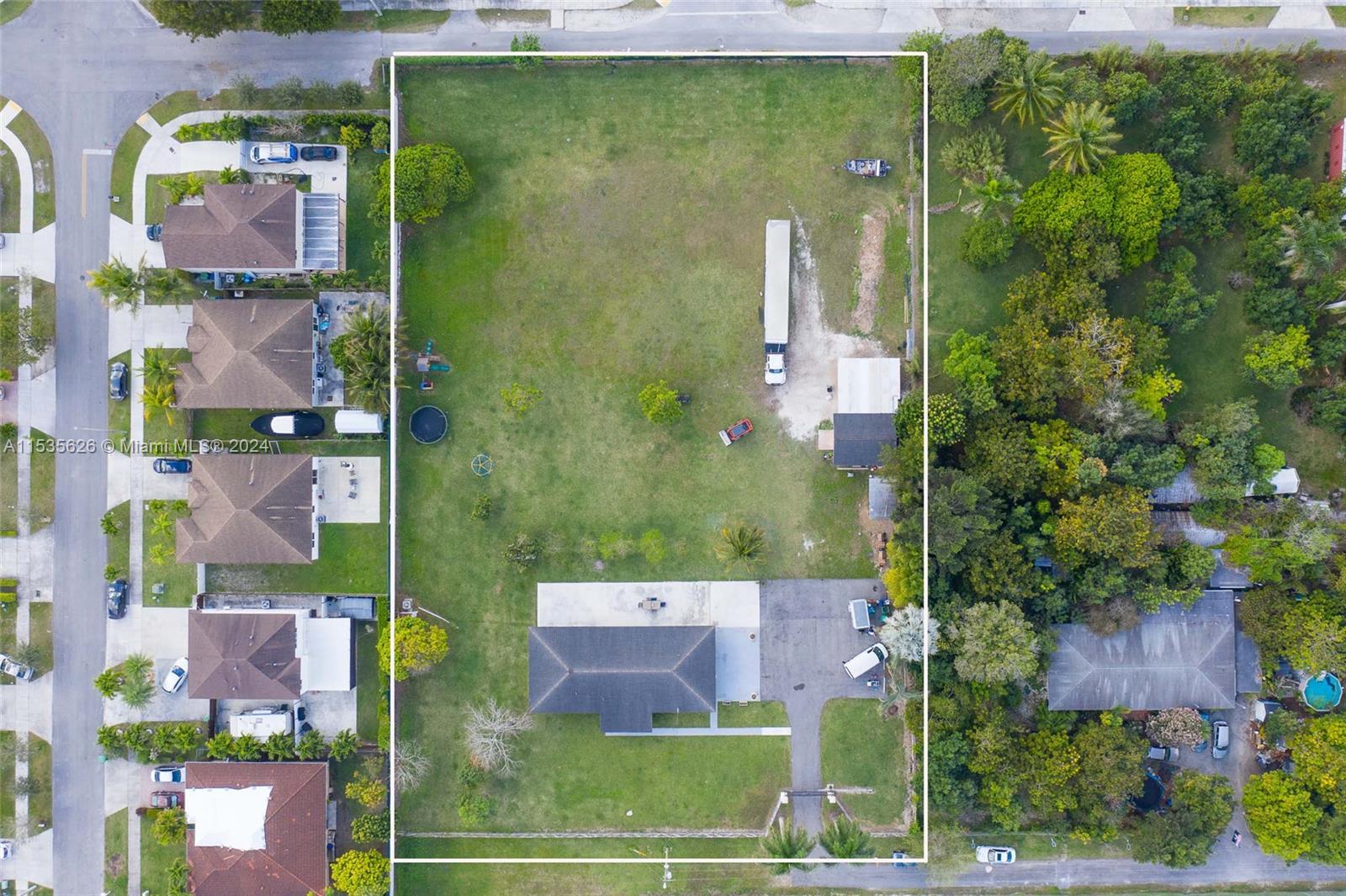 an aerial view of residential house with outdoor space and street view