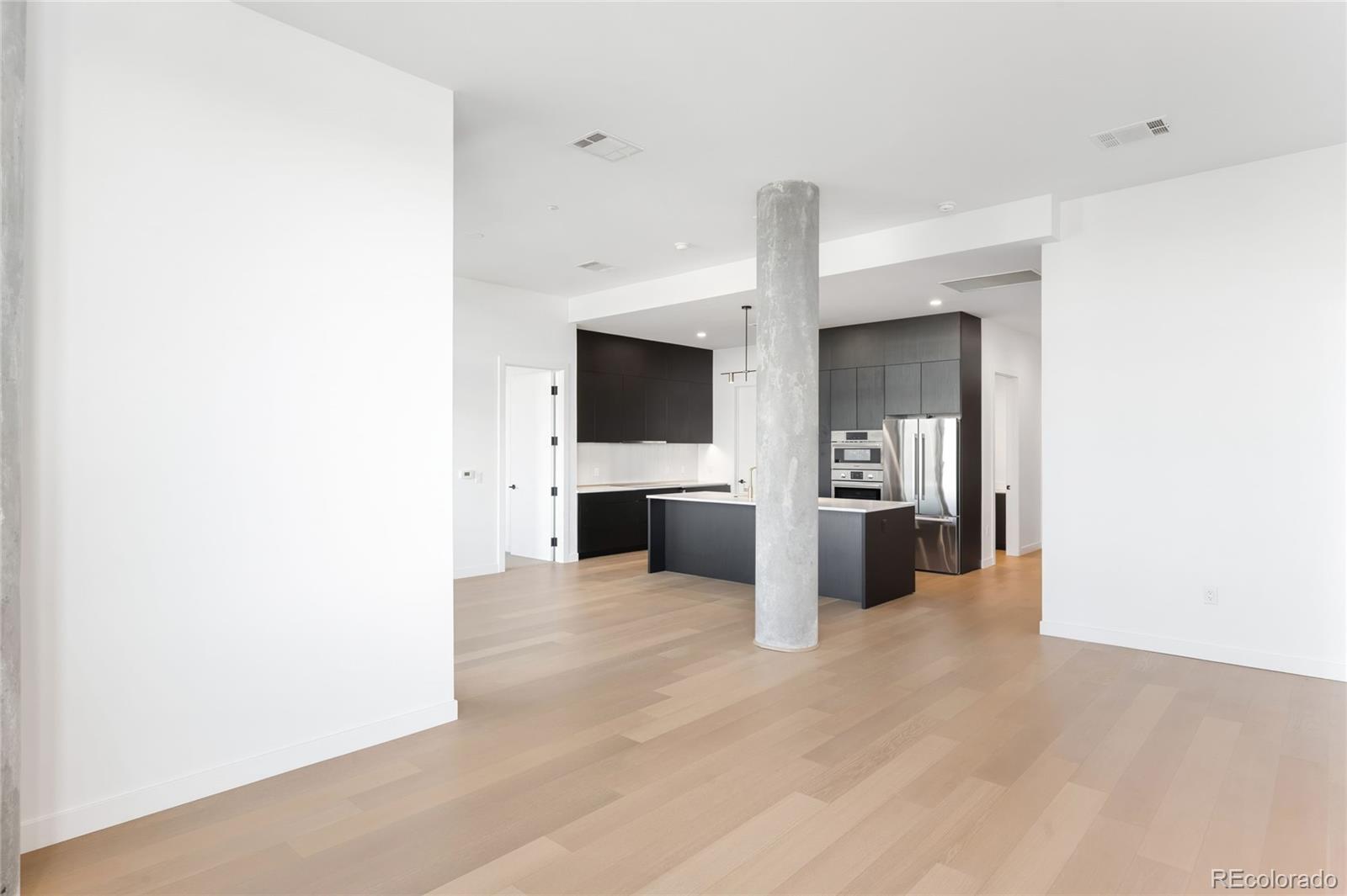3520 Chestnut Place, Unit PH1202 Denver, CO 80216 - Photo 11 of 41 a view of a kitchen with a sink