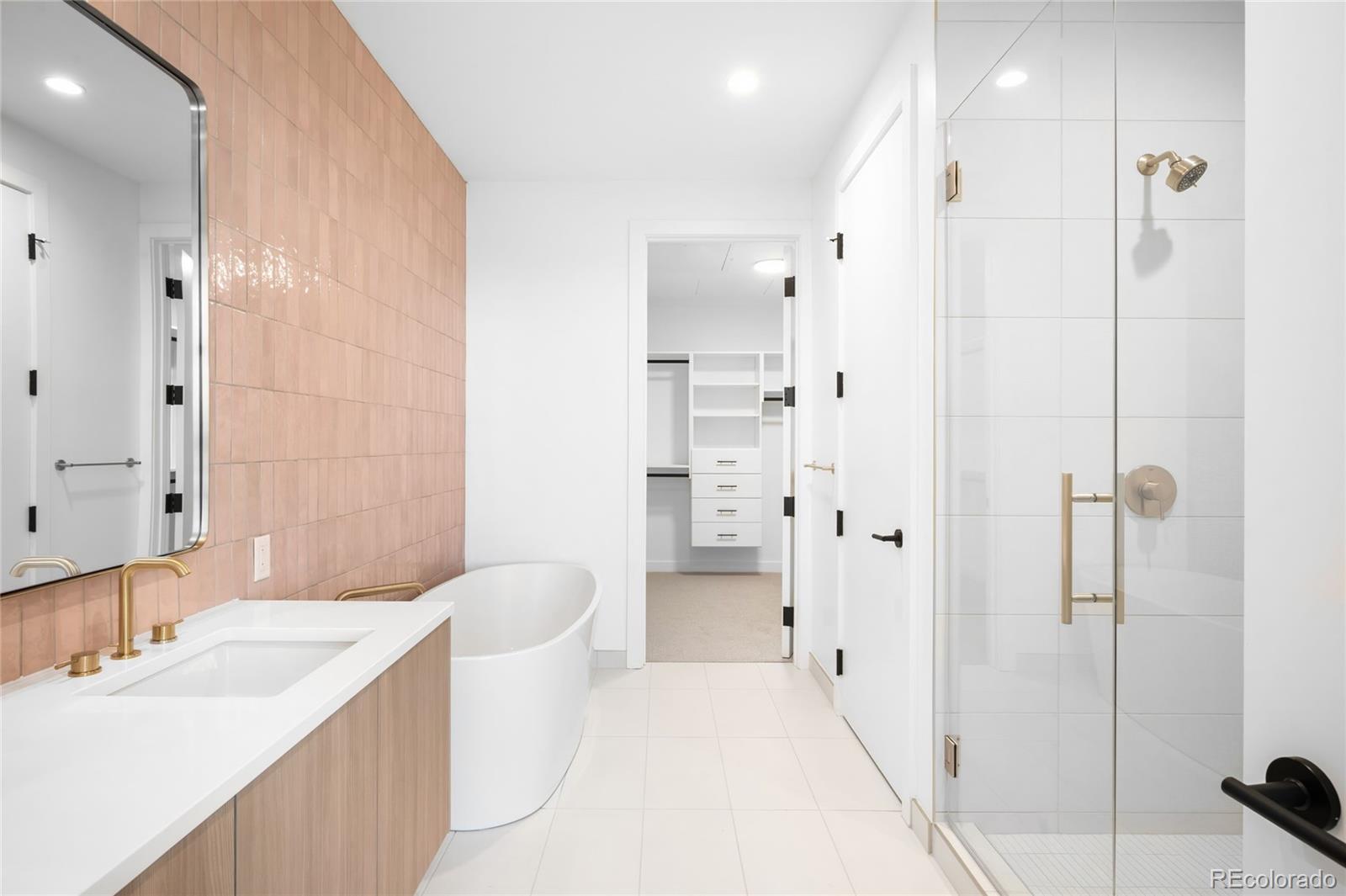 3520 Chestnut Place, Unit PH1202 Denver, CO 80216 - Photo 14 of 41 a spacious bathroom with a bathtub shower sink and toilet