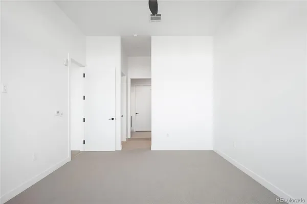 a bathroom with a shower sink and mirror