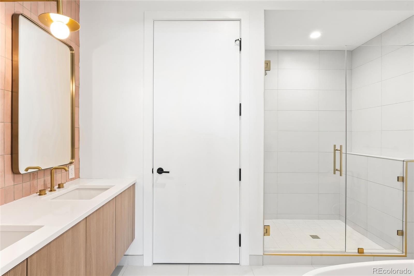 3520 Chestnut Place, Unit PH1202 Denver, CO 80216 - Photo 20 of 41 a bathroom with a shower sink and mirror