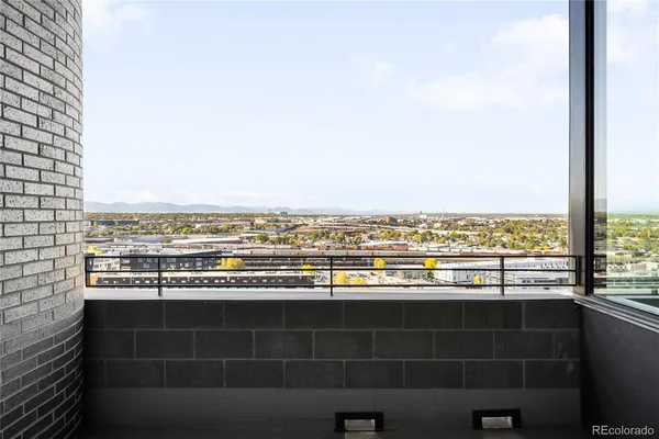 a view of a glass door and a window