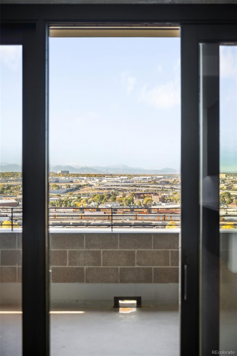 3520 Chestnut Place, Unit PH1202 Denver, CO 80216 - Photo 25 of 41 a view of a glass door and a window