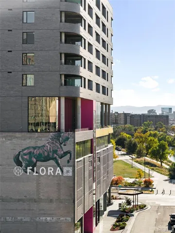 a view of a city from a dining room with furniture