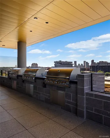 a view of a dining room with furniture large windows and wooden floor