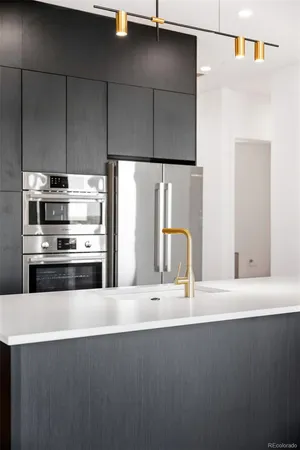 a kitchen with a sink and large window