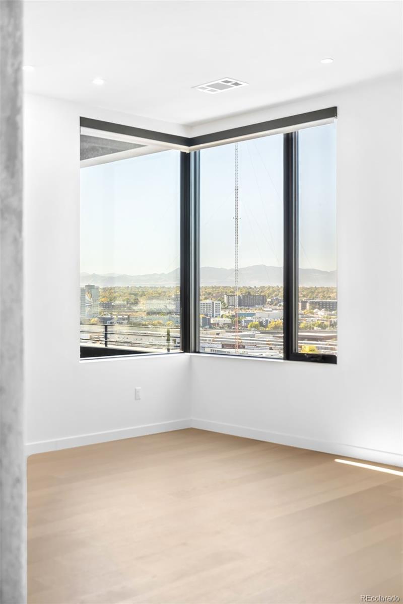 3520 Chestnut Place, Unit PH1202 Denver, CO 80216 - Photo 9 of 41 a view of an empty room with a window