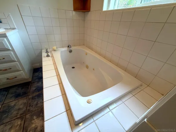 a view of hallway with wooden floor
