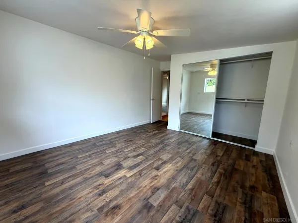 a bathroom with a sink toilet and a mirror