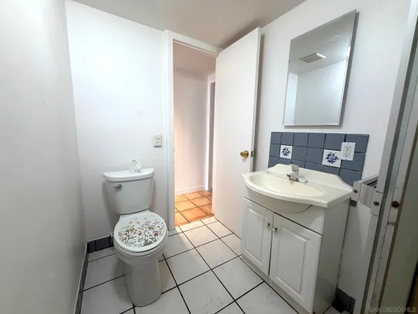 a kitchen with granite countertop a sink and a stove