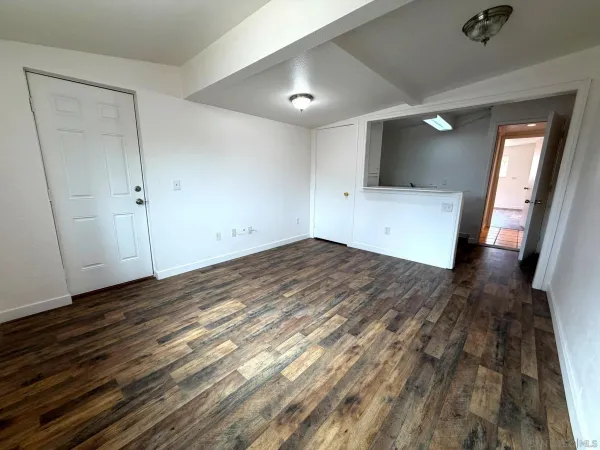 a kitchen with granite countertop a stove and a refrigerator