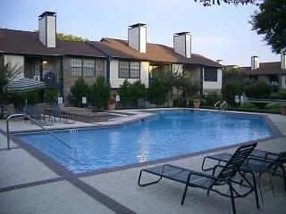 a house view with a seating space and garden