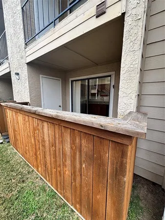 a view of balcony with furniture