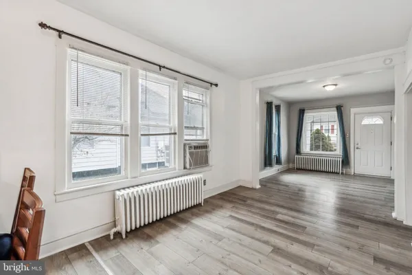 a room with a dresser and a mirror