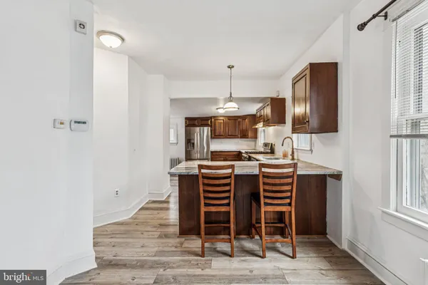 a kitchen with stainless steel appliances granite countertop a stove and a sink