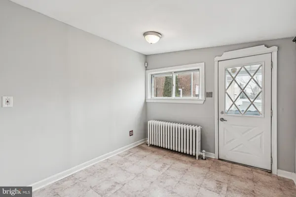a bathroom with a sink a mirror and a window