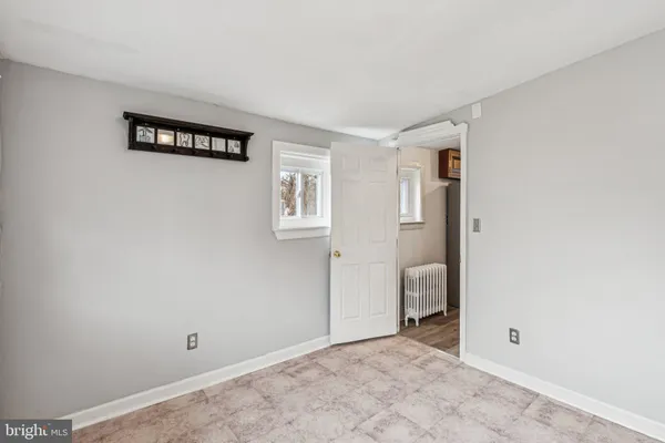 a view of a room with wooden floor and toilet