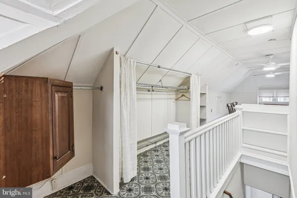 a kitchen with a refrigerator a sink and cabinets