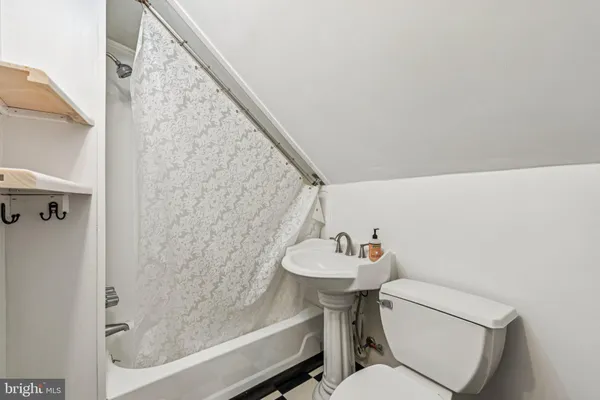 a kitchen with stainless steel appliances kitchen island granite countertop a refrigerator a stove and a sink with cabinets