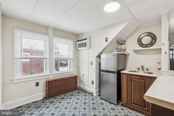 a utility room with sink dryer and washer