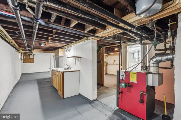 a view of a house with a yard covered in snow