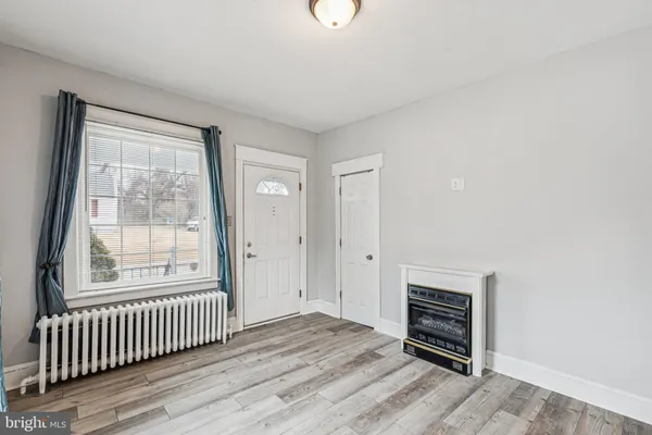 a kitchen with a refrigerator and a stove top oven