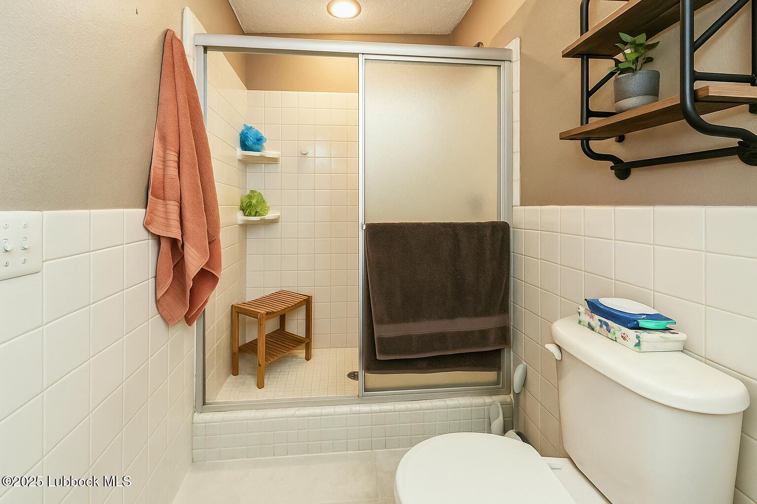 208 South Holliday Plainview, TX 79072 - Photo 14 of 32 a bathroom with a shower toilet and sink