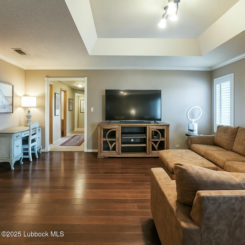 208 South Holliday Plainview, TX 79072 - Photo 20 of 32 a living room with furniture and a flat screen tv