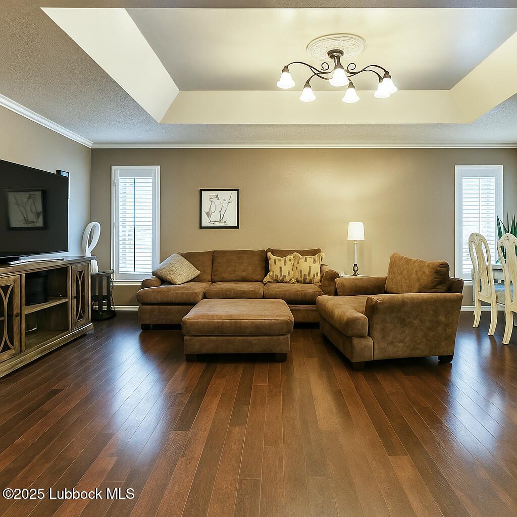 208 South Holliday Plainview, TX 79072 - Photo 21 of 32 a living room with furniture and a flat screen tv