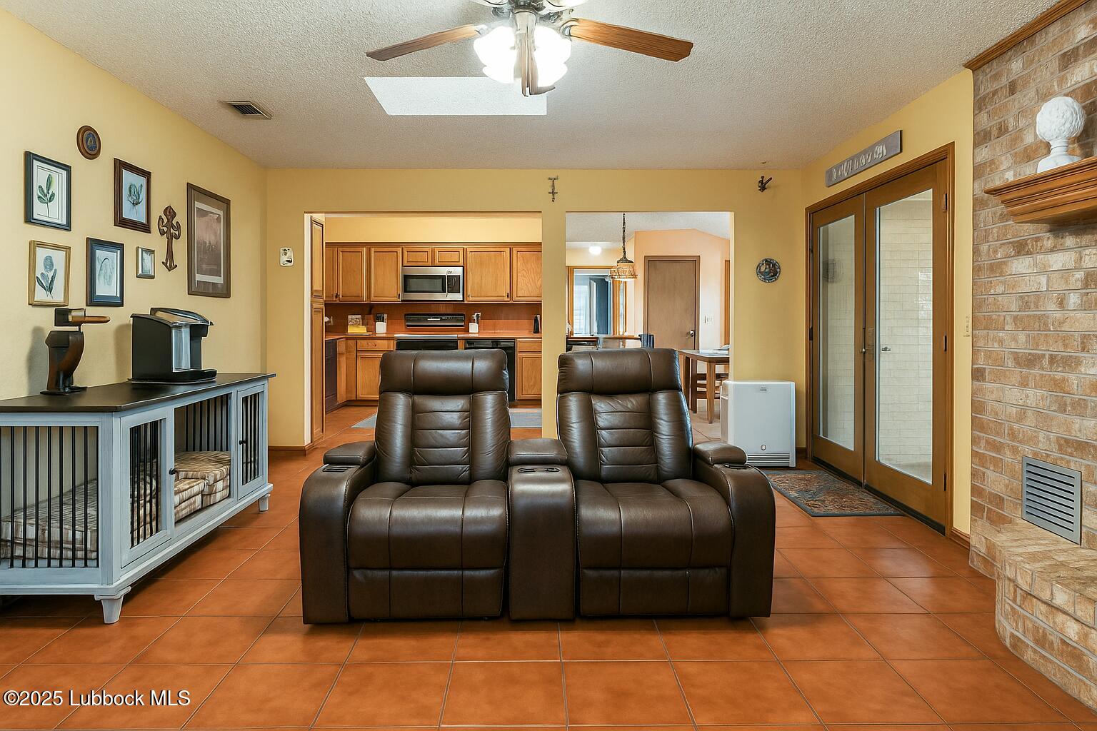 208 South Holliday Plainview, TX 79072 - Photo 6 of 32 a living room with furniture and a flat screen tv