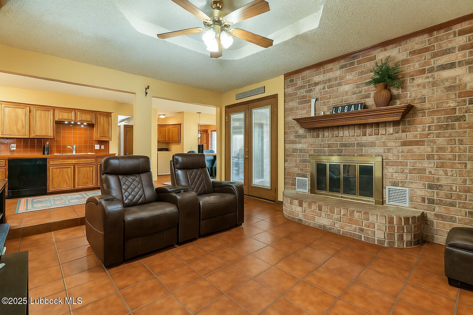 208 South Holliday Plainview, TX 79072 - Photo 7 of 32 a living room with furniture and a fireplace
