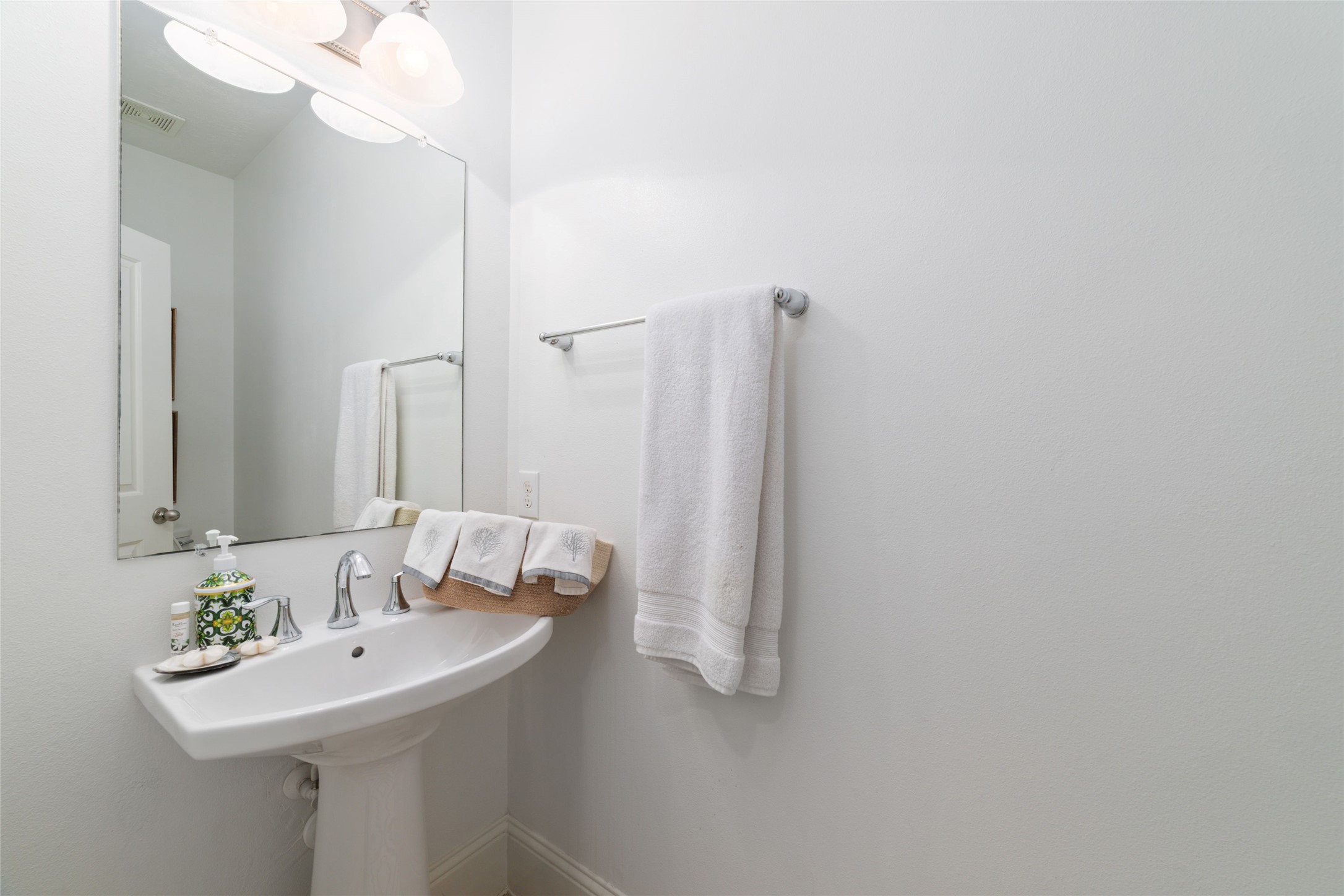 335 Voss Road Houston, TX 77024 - Photo 24 of 45 a bathroom with a sink and a mirror