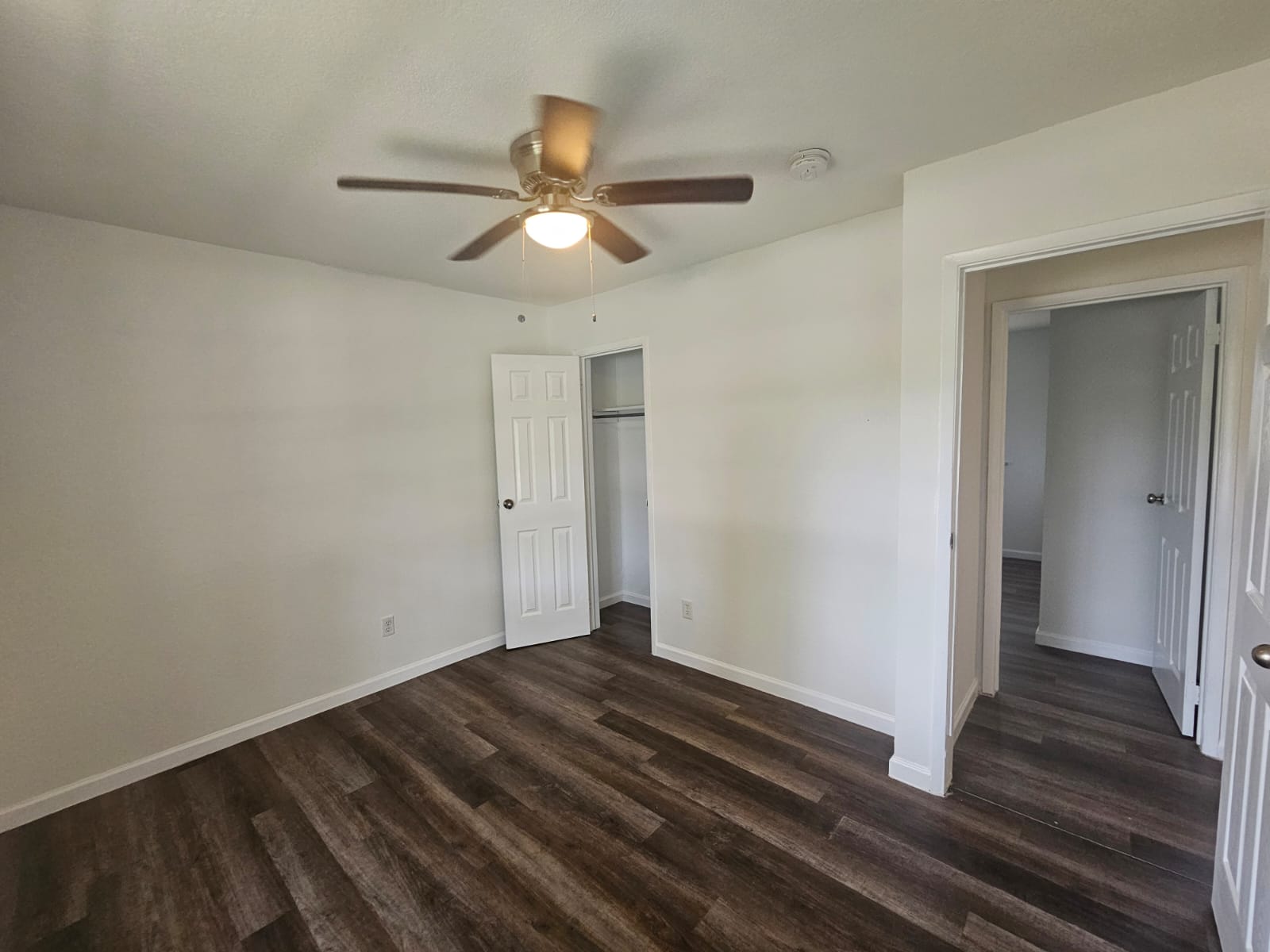 1401 Trinity Street Lockhart, TX 78644 - Photo 11 of 31 Interior room featuring wood-finish flooring and light-toned walls
