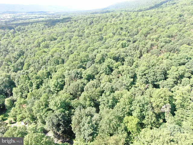 a view of a field with an outdoor space