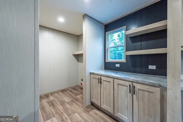a kitchen with a sink and a window