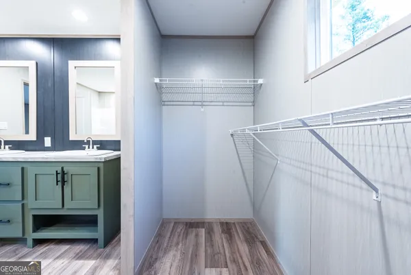 a view of walk in closet with window