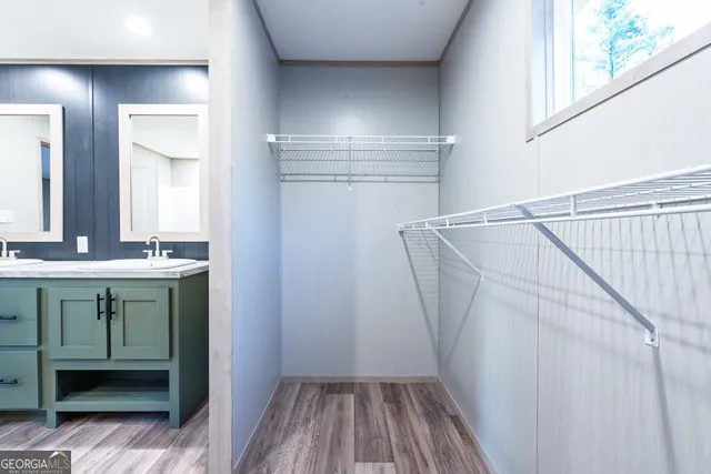 a view of walk in closet with window