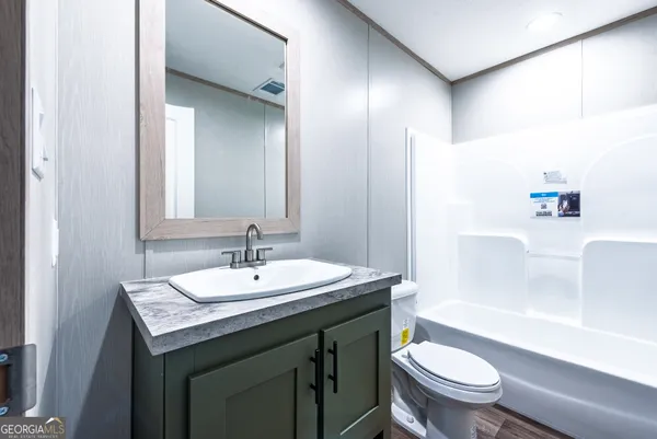 a bathroom with a sink and a toilet