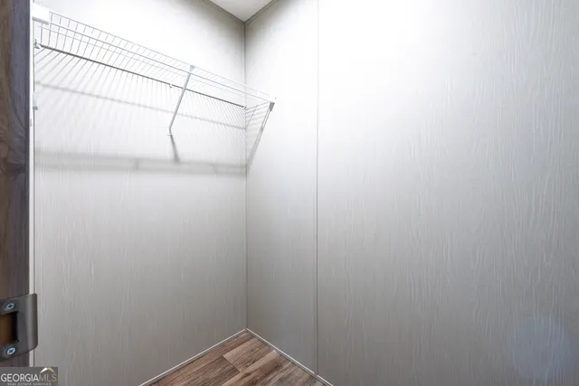 a view of a room with racks on the wall