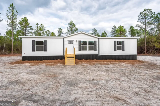 a house with trees in the background
