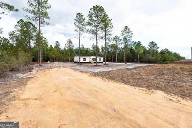 a house with trees in the background