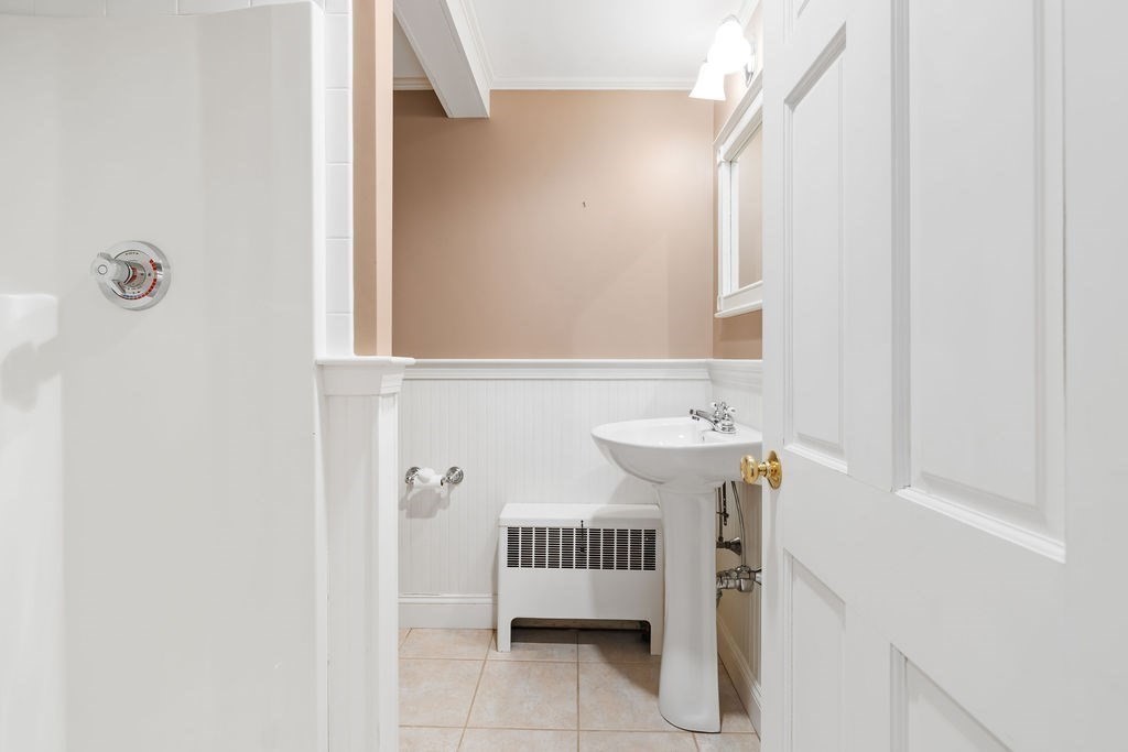 51 Stockdale Road Needham, MA 02492 - Photo 17 of 21 a bathroom with a sink and a mirror