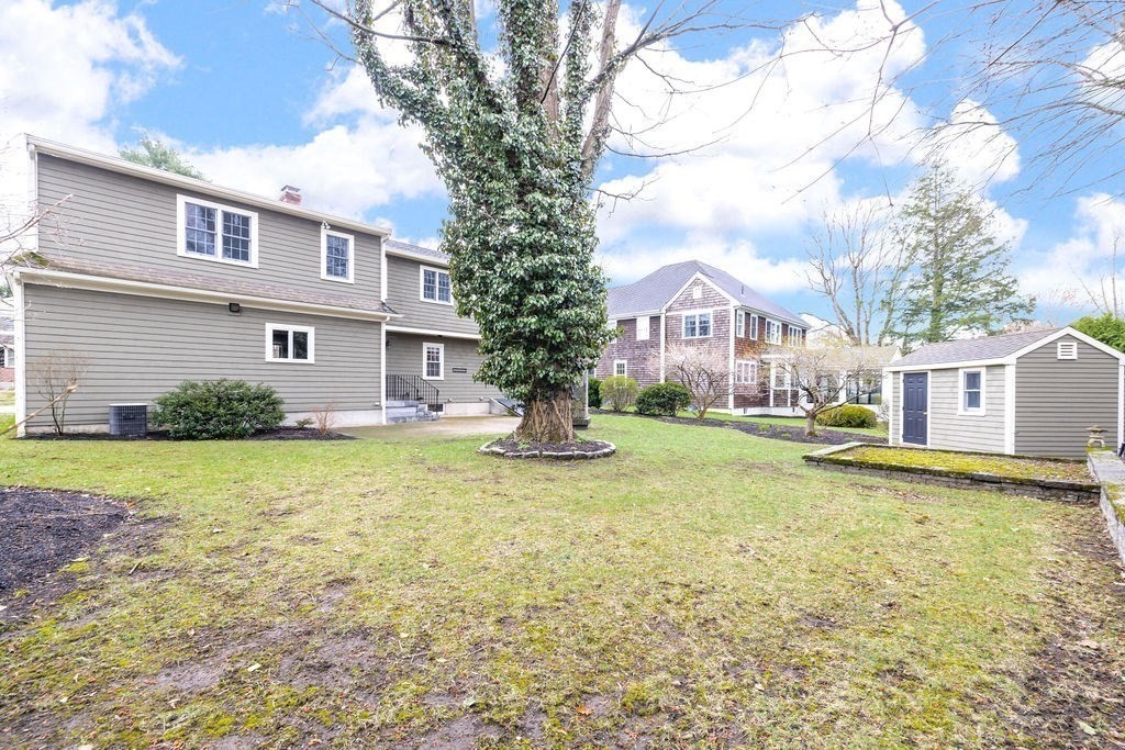 51 Stockdale Road Needham, MA 02492 - Photo 20 of 21 a house with garden in front of it