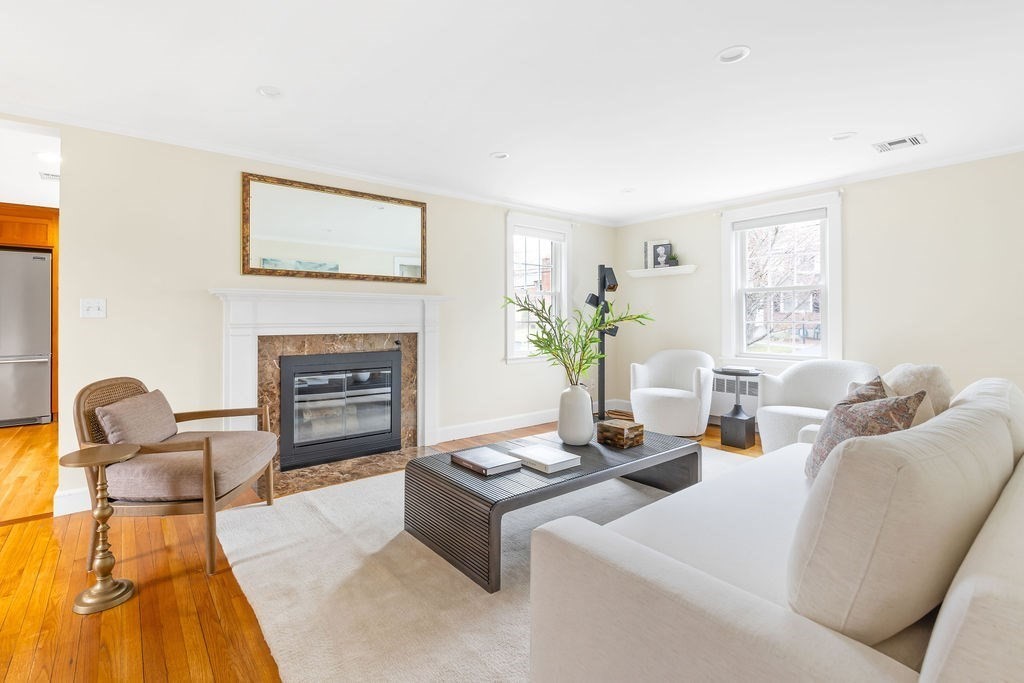 51 Stockdale Road Needham, MA 02492 - Photo 6 of 21 a living room with furniture and a fireplace